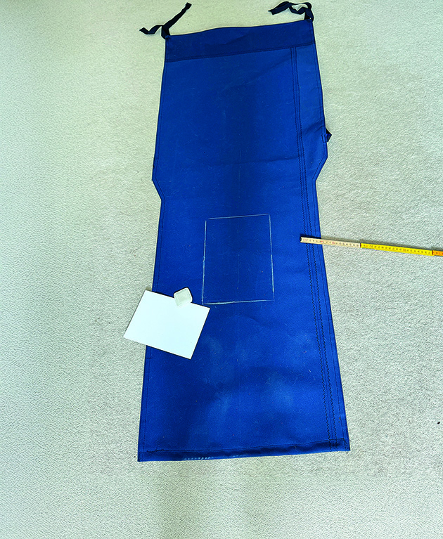 Canvas being measured out on a carpet