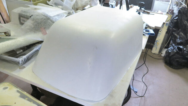 A mould from a bathtub being used to create a doghouse for a yacht