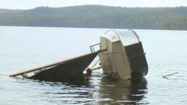 A boat being capsized on a lake