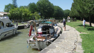 A boat moored up alongside a canal lock