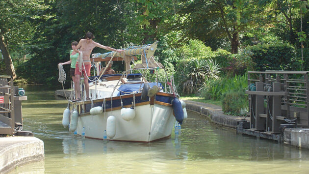 A yacht crew preparing to demonstrate how to use canal locks when motoring downhill