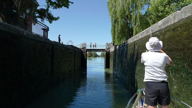 A crew of a yacht demonstrating how to use canal locks