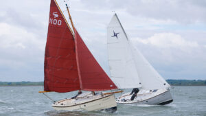 Boat with gaff rigs and boat with Bermudan rig sailing against each other