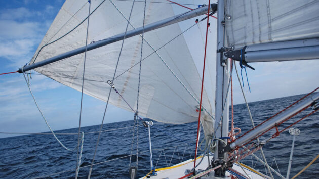 A jib being boomed out on a yacht