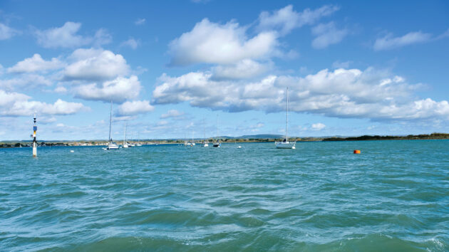 Boats moored in a channel