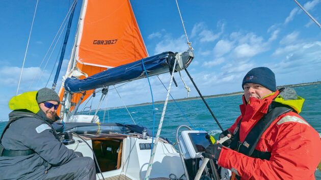 Two people sailing a boat