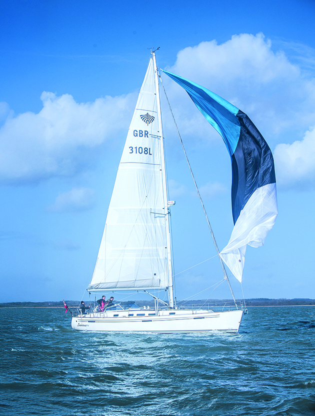 A cruising chute on a boat being depowered ahead of a gybe