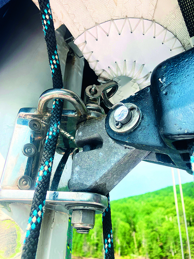 A gooseneck on a rig of a sailboat