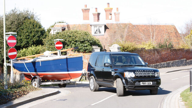 A boat being pulled by a car