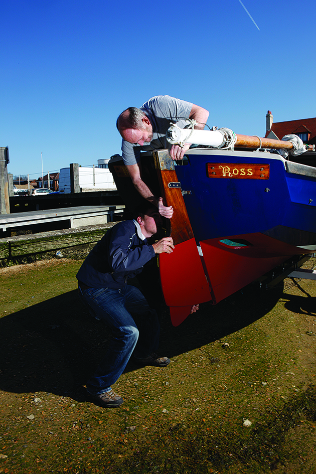 Two men preparing to launch a boat