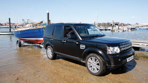 A yacht being trailered up a slipway