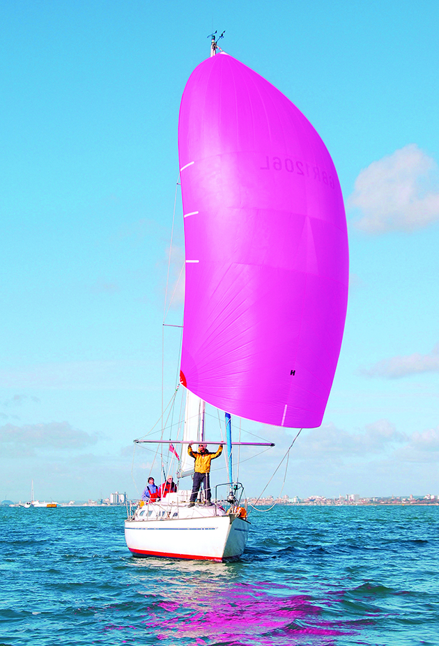 A person getting ready for end to end gybe on a boat