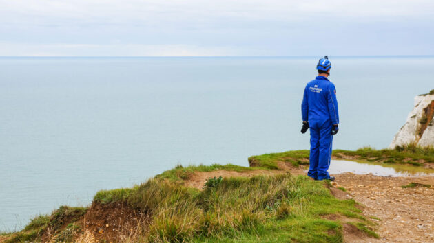 HM Coastguard rescue officer at Beachy Head cliffs near Eastbourne, East Sussex, England. Credit: Marcin Rogozinski Zwei/Alamy