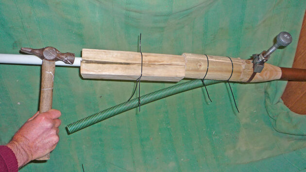 A wooden bung being used on a boat