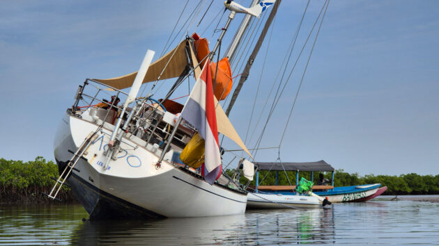 A boat careening in a river as the tide rises