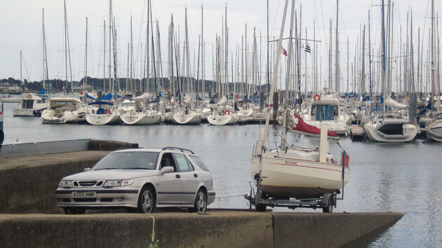 A Red Fox 200 trailer sailer being launched from a slipway