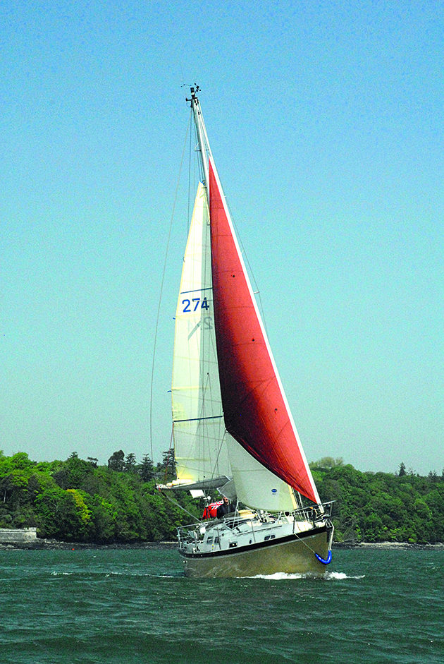 A cutter rig yacht sailing downwind