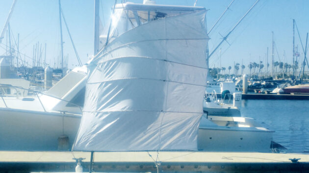 A laser dinghy moored in a marina