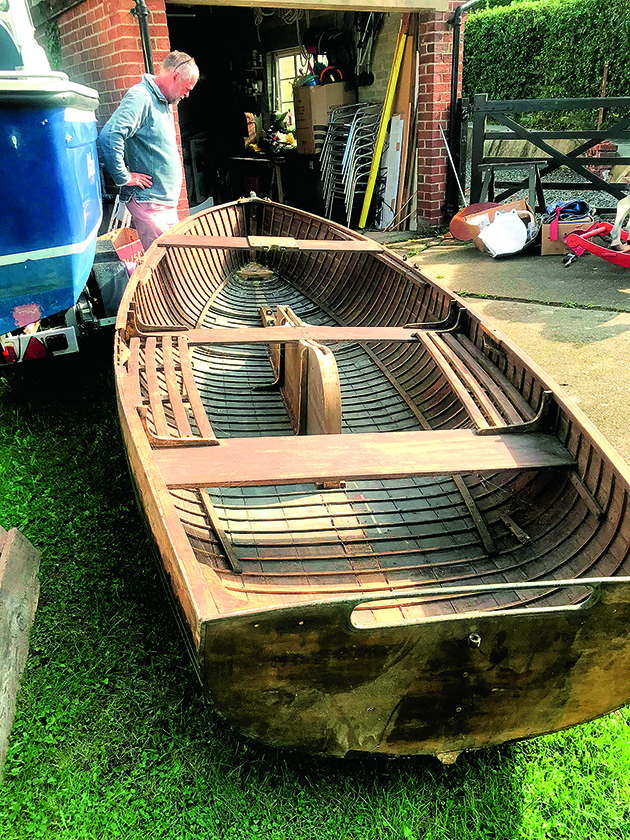 A wooden International 14 dinghy
