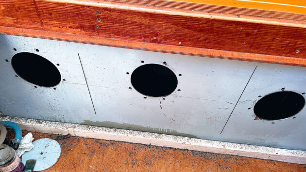 Holes cut into a fuel tank on a boat during a full fuel system clean