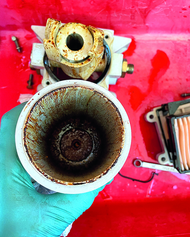 A filter contaminated from a boat engine necessitating a full fuel system clean
