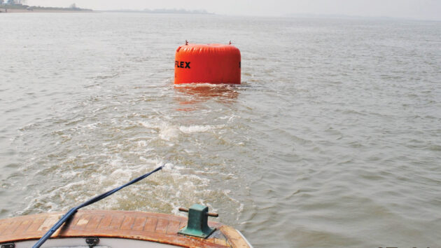 An airbag being used to lay ground tackle for a mooring