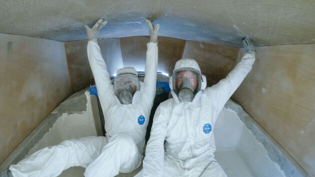 two people refitting a sailboat to make it electric and improve the design