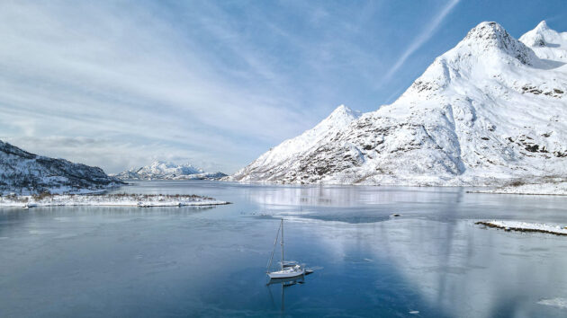 An all electric sailboat anchored in the High Arctic