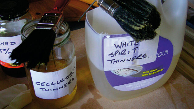 Brushes soaking in white spirit ahead of marine varnishing