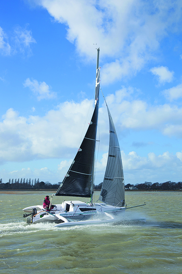 A person sailing a trimaran