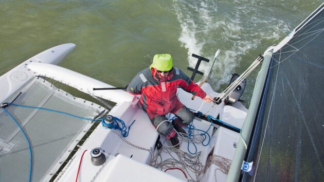 A man steering a Corsair Dash 750 trimaran