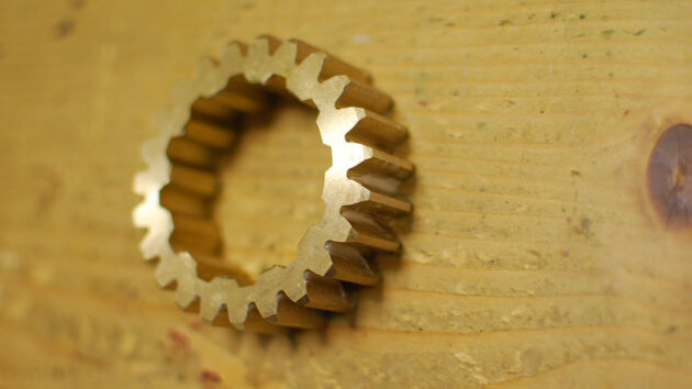 A gear for a winch which has been removed during winch servicing