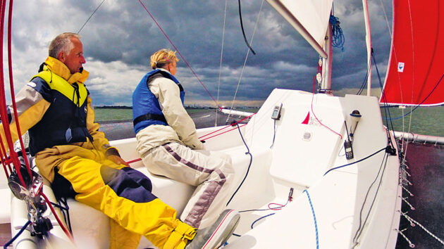 Two people sailing a trimaran