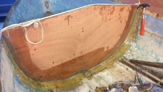 Dinghy repairs which include building a bulkhead