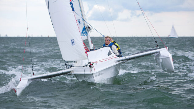 Two people sailing an Astus 20.2 trimaran