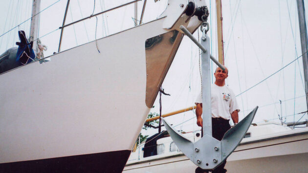 A storm anchor hanging from a yacht