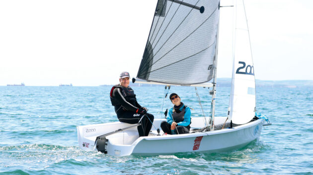 Two people racing in a dinghy