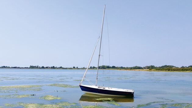 A Wanderer cruising dinghy moored