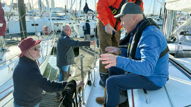 Sir Robin Knox-Johnston with Mike Golding talking on a yacht