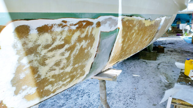 A boat's hull that has been ground back to treat osmosis 