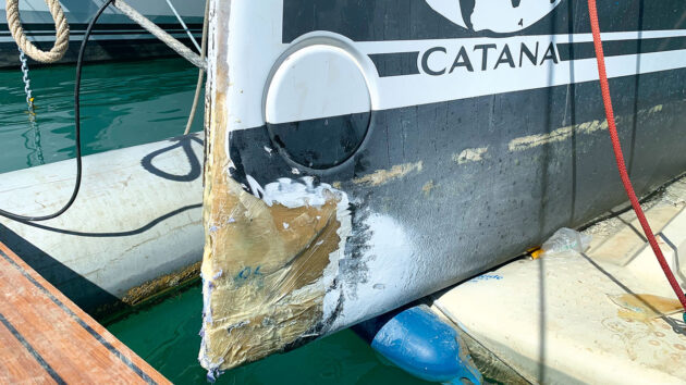 The hull of a catamaran that has been damaged after hitting a UFO at sea