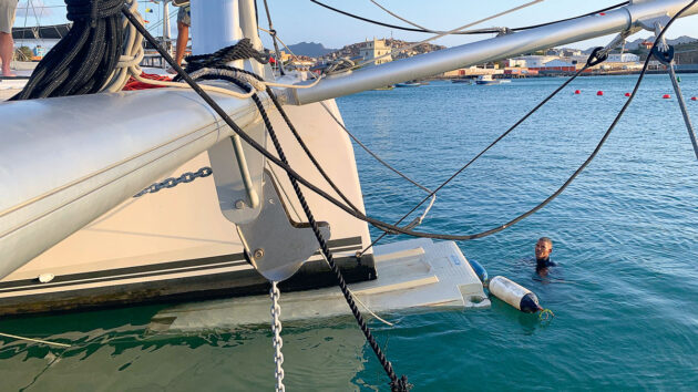 A pontoon being used to raise a hull of a catamaran out of the water to dry out after a UFO collision