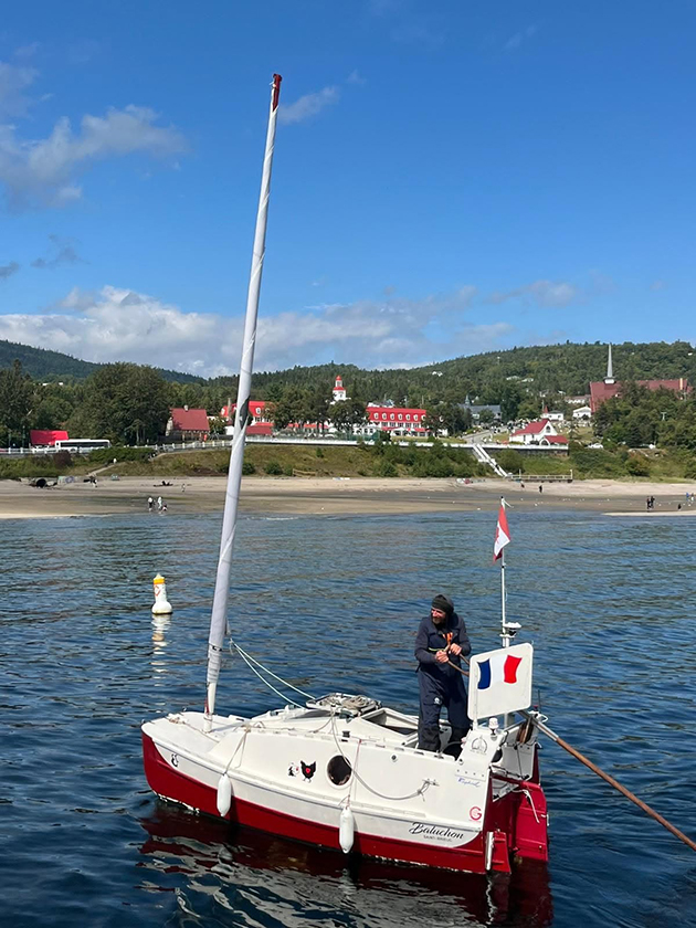 Solo sailor Yann Quenet sailing a small boat