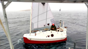 Yann Quenet aboard his 4m boat