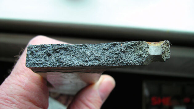 The broken edge of a rudder on a boat