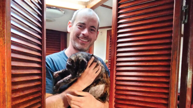 Alex and his cat, Patches, in Portugal. Credit: Alex Carter