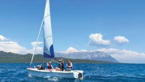 Children learning dinghy sailing in a Bahia, with Seafarer's Sail and Stay holiday in Nikiana, Greece. Credit: Laura Hodgetts