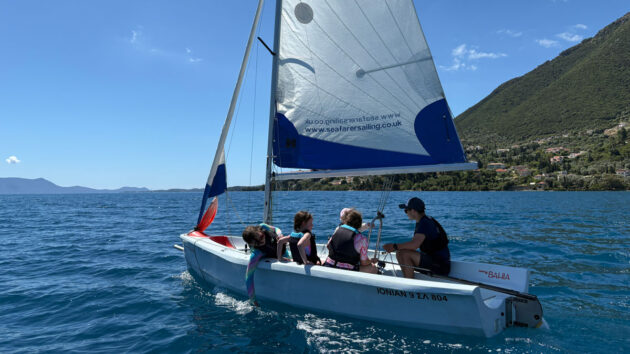 Children learning dinghy sailing in a Bahia, with Seafarer's Sail and Stay holiday in Nikiana, Greece. Credit: Laura Hodgetts
