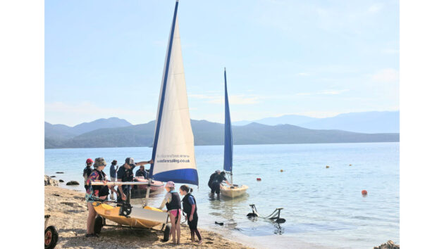 Seafarer instructor Tom with his novice dinghy sailors. Credit: Jason Williams