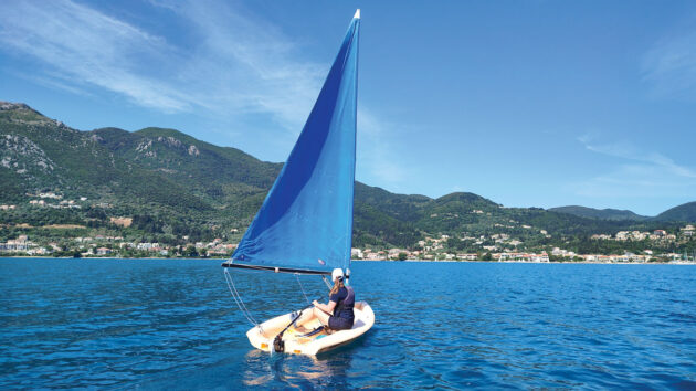 Laura Hodgetts sailing a Pico in the tranquil setting of Nikiana, Greece, during a Sail and Stay charter with Seafarer Holidays